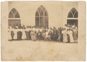 Photographic print of men and women in front of Vernon AME Church, Tulsa