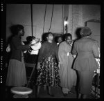 [Store Front Churches. Man in robe with three ladies]