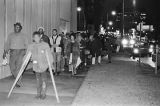 Hosea Williams and other demonstrators marching toward the Jefferson County Courthouse in downtown Birmingham, Alabama, for a nighttime voter registration rally.