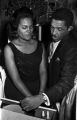 Clara Blackwell and Roscoe Williams looking into a drawer behind a counter at the Laicos Club in Montgomery, Alabama.