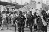 Police officers and marchers at a United Klans of America march and rally in Mobile, Alabama.