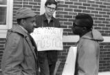 Scott B. Smith of SNCC speaking with Mike Bibler and John Davis of SCLC, in front of the Barbour County courthouse in Eufaula, Alabama.