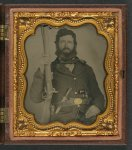 [Unidentified soldier in Union uniform with musket, bayonet and scabbard, Bowie knife, and revolver]