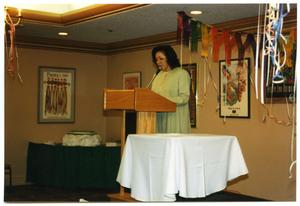 Woman at Podium Delivering Speech