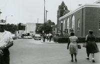 Police officer and protesters on Main Street, Farmville, Va., July 1963