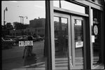 [Liquor store in Birmingham, Alabama with "colored" sign on window, showing separate entrance for African Americans]