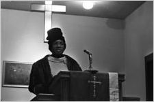 Woman speaking to an audience at Hall Street Baptist Church in Montgomery, Alabama.