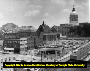 View of the Georgia Capitol area, service station on Hunter Street (now Martin Luther King Jr. Drive) in center, Atlanta, Georgia, August 10, 1965.