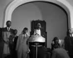 Fred Shuttlesworth speaking at a mass meeting during a campaign to integrate the buses in Birmingham, Alabama.