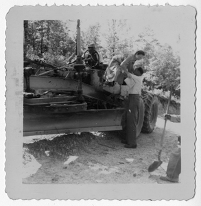 Photograph of a man and woman on a grader, Manchester, Georgia, 1953