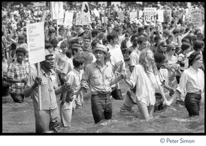 Splashing in the Reflecting Pond during the Poor Peoples’ Campaign Solidarity Day Protesters holding signs reading 'Jobs or income for ALL Americans,' 'No more hunger USA,' and Resistance R.I.