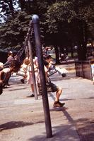 Children playing on a swing set