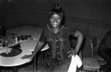 Waitress clearing off tables at the Laicos Club in Montgomery, Alabama, during a performance by Bobby Moore and the Rhythm Aces.