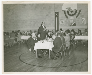 Photograph of a man speaking at an Atlanta Life Insurance Company reception