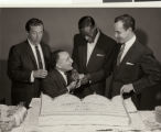 Photographs of Nat King Cole with a cake and various entertainers