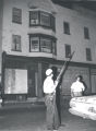 Armed police officers stand outside a building on Joseph Avenue after riot, Rochester, NY, 1964