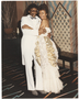 A couple in formal dress and tuxedo.