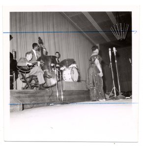 Ella Fitzgerald onstage with Herb Ellis (guitar), Ray Brown (bass), Louis Bellson? (drums), undated.] [Black-and-white photoprint