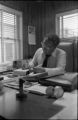 Alex Haley: Seated at desk (AHP 1-79-11 #63)