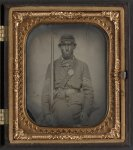 [Unidentified soldier in Union sergeant's uniform with musket and sword]