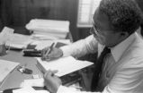 Alex Haley: Seated at desk (AHP 1-79-11 #63)