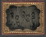 [Five unidentified prisoners of war in Confederate uniforms in front of their barracks at Camp Douglas Prison, Chicago, Illinois]