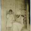 Black woman and child read together in Louisiana