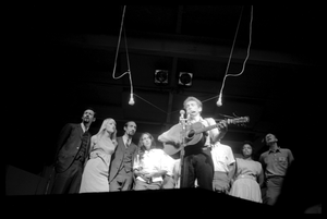 Bob Dylan leading performers on stage, Newport Folk Festival Left to right: Peter Yarrow, Mary Travers, Paul Stookey, Joan Baez, Bob Dylan, Bernice Reagon, Cordell Reagon, Charles Neblett, Rutha Harris, Pete Seeger