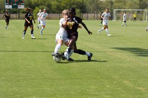 Janaye Woods and opponent fighting for the ball