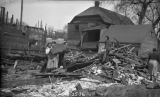 Residents Pick Through Demolition Debris