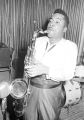 Bobby Moore playing the saxophone on stage at the Laicos Club in Montgomery, Alabama, during a performance by his group, Bobby Moore and the Rhythm Aces.