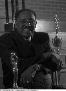 Photograph of coach Marion Tawrice Jones and basketball trophies