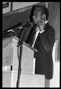 James Baldwin lecturing at UMass Amherst Baldwin standing at a podium with microphones