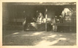 Man Standing on Porch