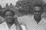 Othar Turner: Gravel Springs and Senatobia, Miss. Fife and drum. Othar and Mrs. Turner. Observers sitting in stands watching baseball game (OTP D-70 #1127)