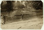 Photos taken during noon hour, October 23rd, 1912, at the Loray Mills, Gastonia, N.C. They said they were working and went in to work. At night I counted over thirty children coming out when the whistle blew, and they seemed to be from ten to twelve years old. The Superintendent was much disturbed over the photos.  Location: Gastonia, North Carolina.