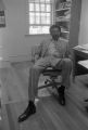 John Blassingame: New York. John Blassingame seated in office, Fredrick Douglas portrait on the wall (BLJP 1-79 #101)