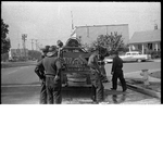 Firemen loading fire hose onto fire truck