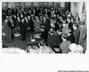 Photograph of President Johnson signing the Civil Rights Act of 1964