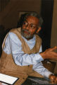 Amiri Baraka looking at a photograph