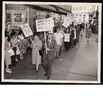 C.L. Dellums stands in picket line holding sign, "Negro kids are going to jail trying to eat at Woolworth and Kress"