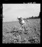 Child of impoverished Negro tenant family working on farm. Alabama