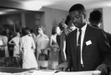 North Carolina Volunteer examining papers.