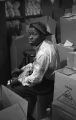 Jasper Wood Collection: Man sitting among boxes