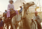 Bernice Pitts riding a camel in Cairo, Egypt