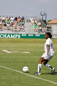 Amanda Johnson following the soccer ball