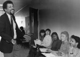 Arnold Mitchem laughs while teaching a class of Educational Opportunity Program students, 1984