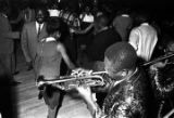 Bennie "Buckwheat" Payne (trumpet) and Archie Moore (trombone) of The Sheiks playing in front of the stage at the Laicos Club in Montgomery, Alabama.