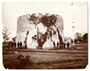 African American troops and officers standing by the Round Tower; note lawn mower.