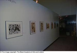 Photograph of an African gallery wall, featuring of seven art works